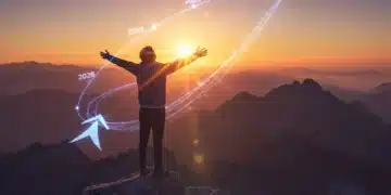 Person triumphantly overlooking a sunrise from a mountain peak, symbolizing achieving personal goals by 2026.